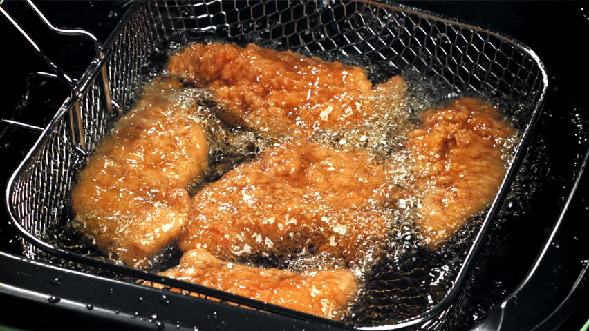 Chicken nuggets are fried in oil. Filmed on a high-speed camera at 1000 fps. High quality FullHD footage