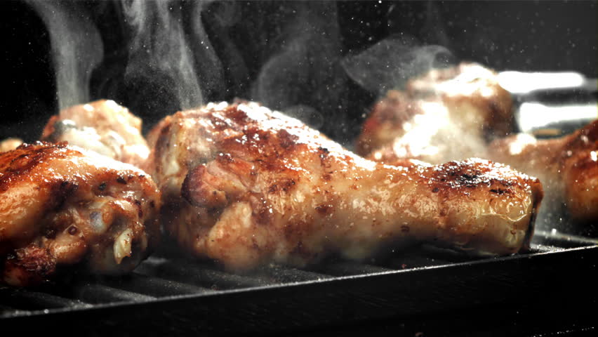 Chicken legs are fried in a pan. Filmed on a high-speed camera at 1000 fps. High quality FullHD footage