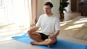 Practicing mindfulness and meditation at home in a sunlit living room during afternoon hours - Powered by Shutterstock - Get 15% off with code: PIKWIZARD15