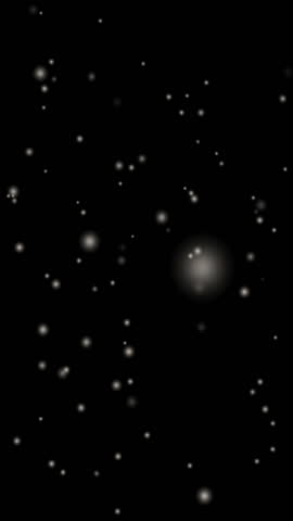 Falling white blurry spots snow on black background. Snowstorm. Loop seamless text. Element animated looping. Vertical