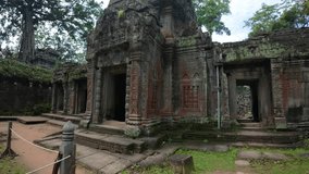 The image depicts moss-covered ruins being overtaken by large tree roots, reflecting the powerful growth of nature in an ancient, overgrown structure. Siem Reap Tomb Raider , Banteay Kdei Temple 
 - Powered by Shutterstock - Get 15% off with code: PIKWIZARD15
