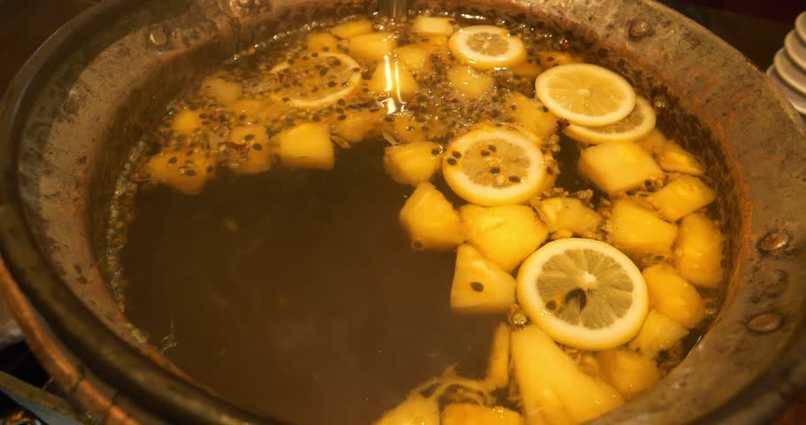 Hot mulled wine with lemon and pineapple