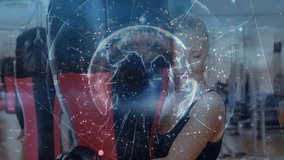 Female boxer training with boxing bag in gym showing fitness data with digital graphics and globe. Athlete, fitness, digital, technology, sport, strength, training - Powered by Shutterstock - Get 15% off with code: PIKWIZARD15