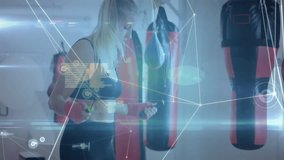 Female fitness enthusiast jumping rope in gym studio, showcasing fitness tech data overlay graphics. Athletic, modern, energetic, performance, training, digital, innovative - Powered by Shutterstock - Get 15% off with code: PIKWIZARD15