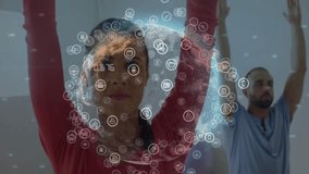 man and woman raising arms overhead in fitness studio, interacting with digital globe network icons. Technology, collaboration, innovation, fitness, networking, connectivity, modern - Powered by Shutterstock - Get 15% off with code: PIKWIZARD15
