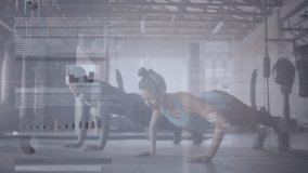 Man and woman doing synchronized push-ups in industrial gym, displaying floating performance charts. Fitness, workout, strength, training, motion, modern, determination - Powered by Shutterstock - Get 15% off with code: PIKWIZARD15
