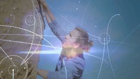 Man climbing rock face outdoors, displaying digital overlay charts for technology presentations. Adventure, exploration, rugged, determination, innovation, endurance, outdoor - Powered by Shutterstock - Get 15% off with code: PIKWIZARD15