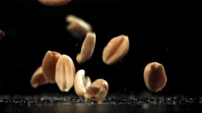 Peanuts fall on the table. Filmed on a high-speed camera at 1000 fps. High quality FullHD footage - Powered by Shutterstock - Get 15% off with code: PIKWIZARD15