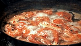 The shrimps fall with splashes into the boiling water. Filmed on a high-speed camera at 1000 fps. High quality FullHD footage - Powered by Shutterstock - Get 15% off with code: PIKWIZARD15