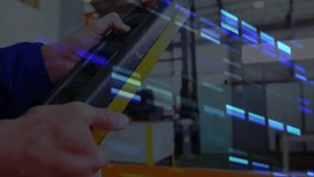 Crane operator holding control pendant at manufacturing warehouse, showing digital glitch overlay. Industrial, machinery, safety, automation, control, engineering, technology - Powered by Shutterstock - Get 15% off with code: PIKWIZARD15