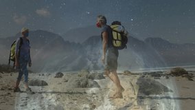 Woman hiker and man hiker exchanging fist bump on rocky beach, with digital technology overlay. Adventure, exploration, outdoor, rugged, nightscape, travel, trekking - Powered by Shutterstock - Get 15% off with code: PIKWIZARD15