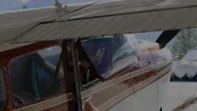 Airplane cockpit wing being overlaid with green, blue market charts in double-exposure illustration. Aviation, finance, investment, aeronautics, data visualization, business, technology - Powered by Shutterstock - Get 15% off with code: PIKWIZARD15