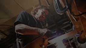 Metalworker grinding metal with angle grinder in factory, with animated sparks and data overlays. Industrial, craftsmanship, workshop, safety, precision, grit, durability - Powered by Shutterstock - Get 15% off with code: PIKWIZARD15