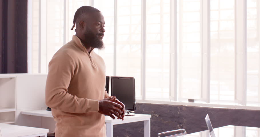 African American man presenting business graph on whiteboard in modern office. Presentation, meeting, corporate, professional, analysis, strategy