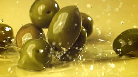Fresh olives fall with splashes into the oil. Filmed on a high-speed camera at 1000 fps. High quality FullHD footage - Powered by Shutterstock - Get 15% off with code: PIKWIZARD15