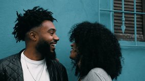 Joyful African American Couple Sharing Laughter in City, Happy Young Black People Enjoying a Moment Outside, authentic real life laugh and smile - Powered by Shutterstock - Get 15% off with code: PIKWIZARD15