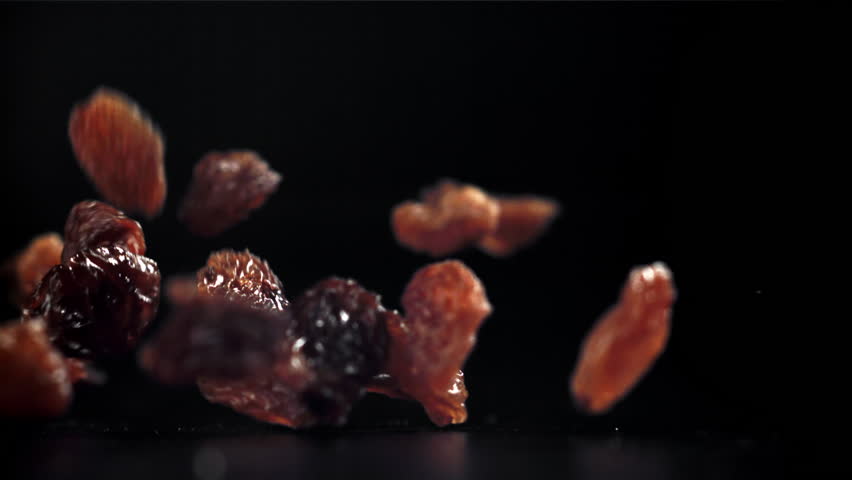 Raisins fall on the table. Filmed on a high-speed camera at 1000 fps. High quality FullHD footage