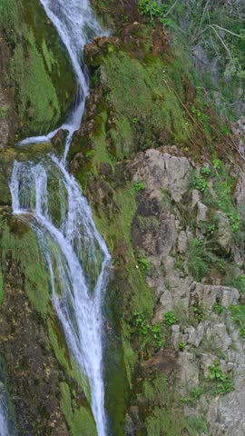Beauty landscape with mountains lake. Waterfall trekking through nature. A refreshing summer waterfalls. The sound of a waterfall in the forest. Peace at waterfall. The idyllic beauty of a waterfall.