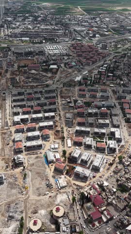 Aerial drone footage of the newly constructed TOKİ housing units in Yeni Azerbaycan neighborhood, Kahramanmaraş, Turkey. Captured in 2025, these single-take shots in both vertical and horizontal forma