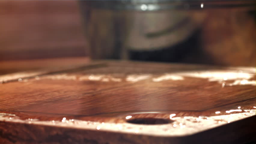 The shrimp falls on a wooden cutting board. Filmed on a high-speed camera at 1000 fps. High quality FullHD footage
