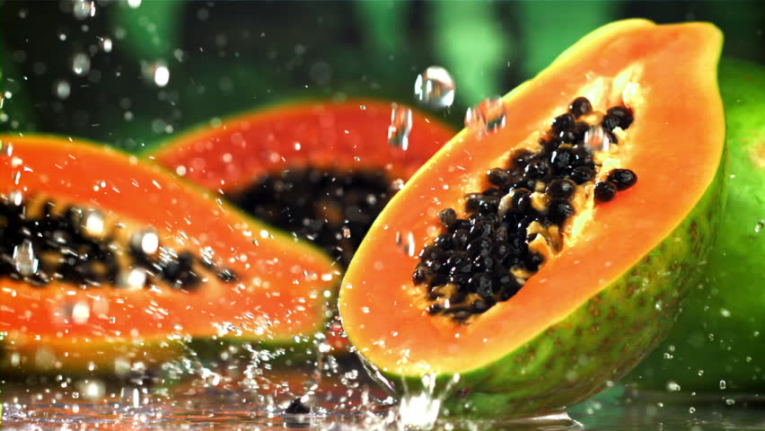 Fresh tropical papaya with drops and splashes of water. Filmed on a high-speed camera at 1000 fps. High quality FullHD footage