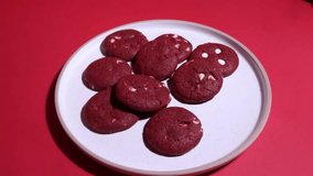Red velvet cookies with heart confetti falling. Valentine’s romance, slow motion, 4K overhead shot. - Powered by Shutterstock - Get 15% off with code: PIKWIZARD15