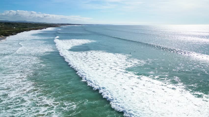 Ocean waves crash on a scenic coast in Portugal's Alentejo, peaceful and wide view