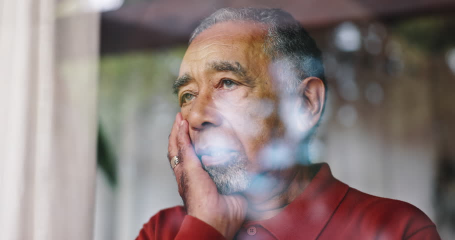 Regret, thinking and window with senior man in retirement home for depression or sadness. Anxiety, mistake and mourning with unhappy old person in apartment for contemplation, decision or memories