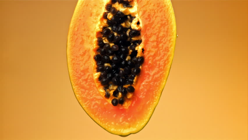 Fresh papaya with a splash of juice. Filmed on a high-speed camera at 1000 fps. High quality FullHD footage
