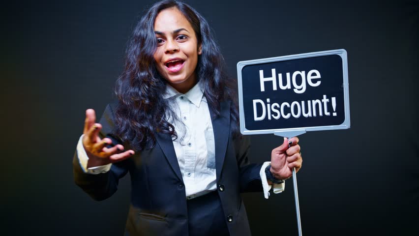 Woman holding huge discount signboard in exhibition, Promoter holds signage pointing massive deal at trade fair, Advertiser raises banner announcing best bargain, Model displays flash sale by showroom - Powered by Shutterstock - Get 15% off with code: PIKWIZARD15