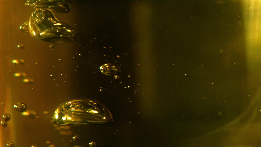 Bubbles of olive oil. Filmed on a high-speed camera at 1000 fps. High quality FullHD footage
