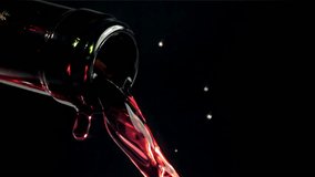 Red wine is poured out of the bottle. Filmed on a high-speed camera at 1000 fps. High quality FullHD footage - Powered by Shutterstock - Get 15% off with code: PIKWIZARD15