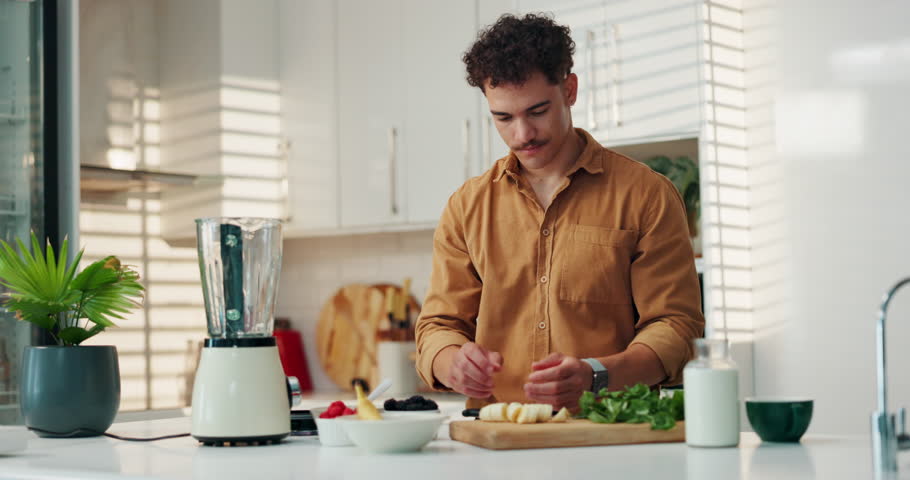 Kitchen, blender and man with fruit for breakfast with diet, wellness and health in home. Nutrition, ingredients and male person with mixer for detox beverage with weightloss snack in apartment.
