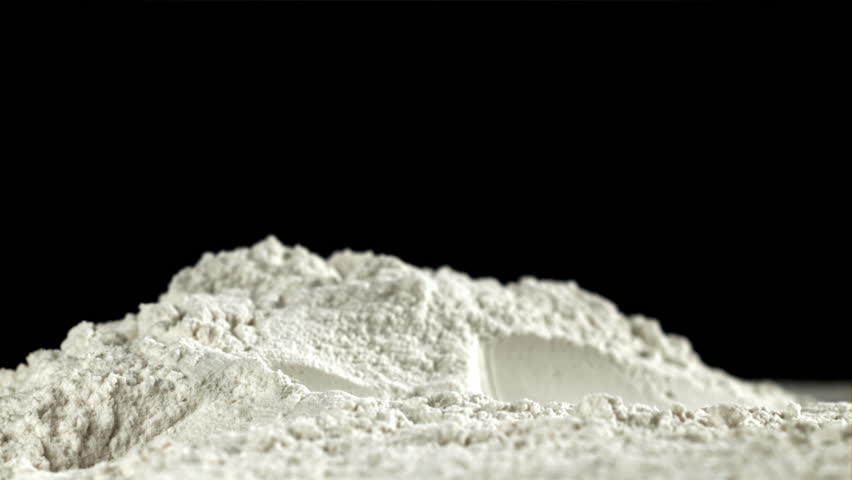 The rolling pin falls into the flour. Filmed on a high-speed camera at 1000 fps. High quality FullHD footage