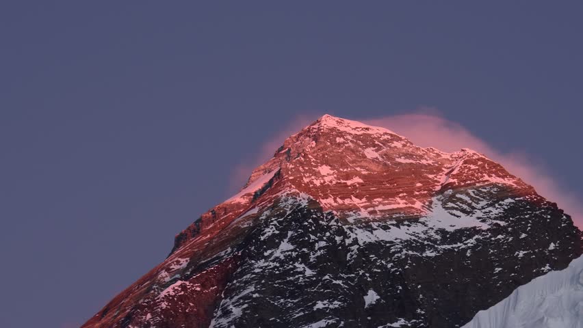 Close up zoom out evening colored view of Mount Everest from Kala Patthar, Khumbu valley, Solukhumbu, Sagarmatha national park, Nepal. Trekking to EBC. Copy space top the world