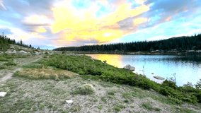 Panning Across Lawn Lake at Sunset In Rocky Mountain National Park - Powered by Shutterstock - Get 15% off with code: PIKWIZARD15
