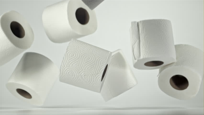 Toilet paper falling on the table on a white background. Filmed on a high-speed camera at 1000 fps. High quality FullHD footage