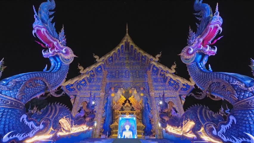 Chiang Rai, Thailand - 1st february ,2024: time lapse illuminated Wat Rong Suea Ten or Blue Temple, Chiang Rai, Thailand. Modern artistic design futuristic buddhism temple