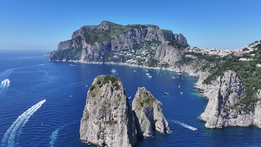 Faraglioni At Capri In Naples Italy. Island Landscape. Tourism Landmark. Faraglioni At Capri In Naples Italy. Bay Of Naples Skyline. Cultural Heritage Coastal. Paradise Capri Island.