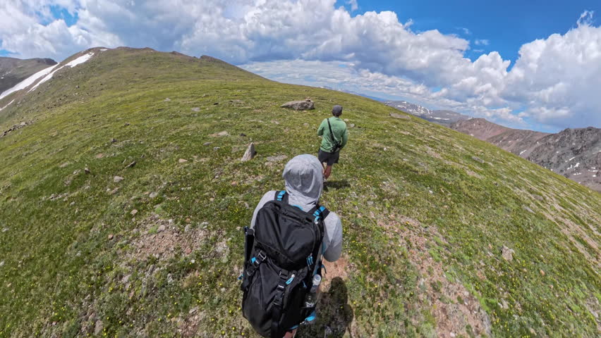 Two People Hike Across the Saddle In Rocky Mountain National Park