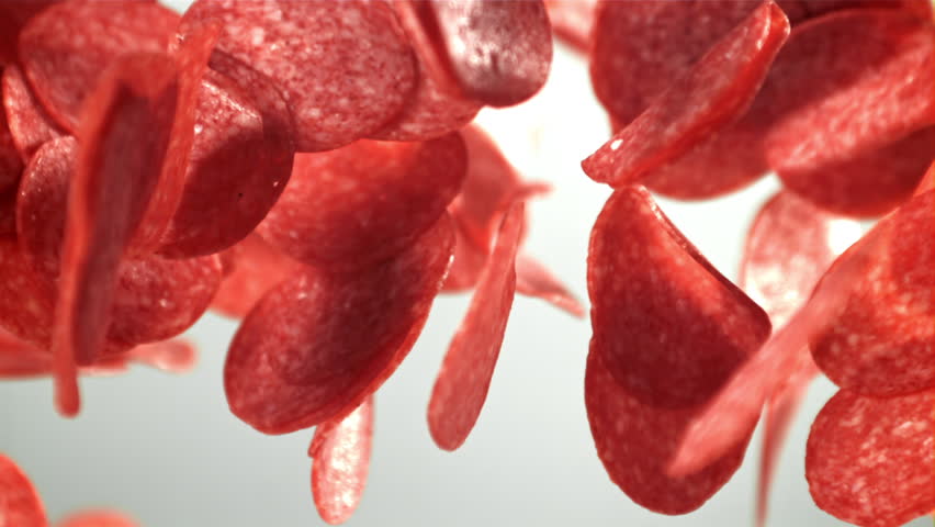 Sliced salami flies up and falls down. Filmed on a high-speed camera at 1000 fps. High quality FullHD footage