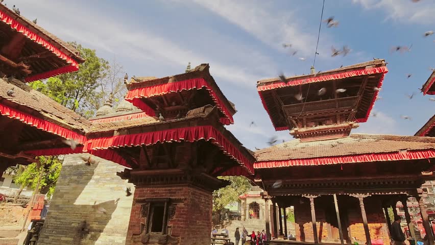 Bhaktapur, Nepal - 6th january, 2024: zoom out banner time lapse tourist visit famous sunny Durbar Square - historically and culturally significant site in Kathmandu, Nepal. Unesco world heritage site