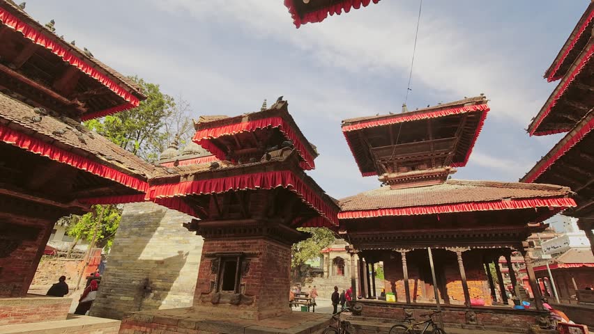 Bhaktapur, Nepal - 6th january, 2024: zoom out banner time lapse tourist visit famous sunny Durbar Square - historically and culturally significant site in Kathmandu, Nepal. Unesco world heritage site