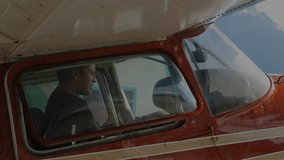 pilot navigating red plane cockpit, displaying animated stock market chart with candlestick bars. Aviation, finance, technology, business, adventure, control, data visualization - Powered by Shutterstock - Get 15% off with code: PIKWIZARD15