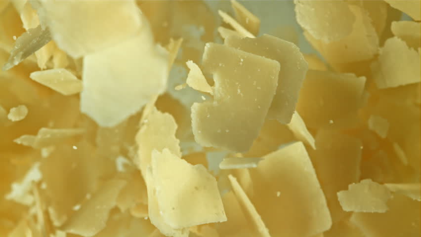 Parmesan cheese flies up and falls down. Filmed on a high-speed camera at 1000 fps. High quality FullHD footage