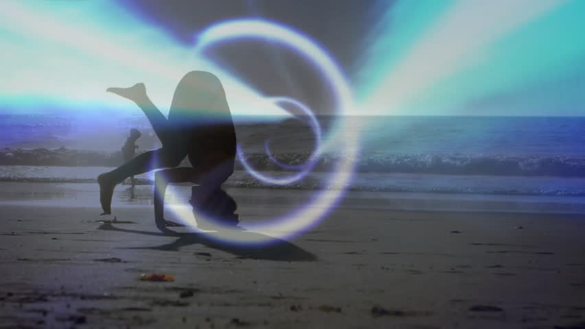 Woman performing headstand on sandy beach at sunrise, with animated light ring suggesting health. Silhouette, sunrise, beach, ocean, light effect, natural landscape, relaxation
