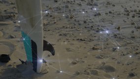 Surfboard tail showing 3D network overlay connecting glowing nodes across wet sand and waves. Seashore, aquatic, digital, innovation, technology, leisure, oceanic - Powered by Shutterstock - Get 15% off with code: PIKWIZARD15
