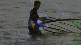 Man adjusting windsurfing sail in shallow ocean water, showcasing digital globe network overlay. Sports, adventure, technology, marine, exploration, scenic, energetic - Powered by Shutterstock - Get 15% off with code: PIKWIZARD15