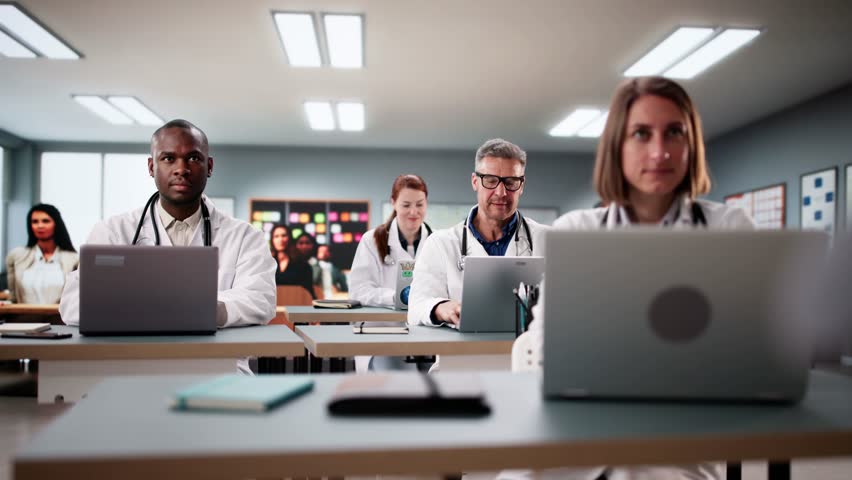 Medical University Students Listening To Professor Doctor In Classroom - Powered by Shutterstock - Get 15% off with code: PIKWIZARD15