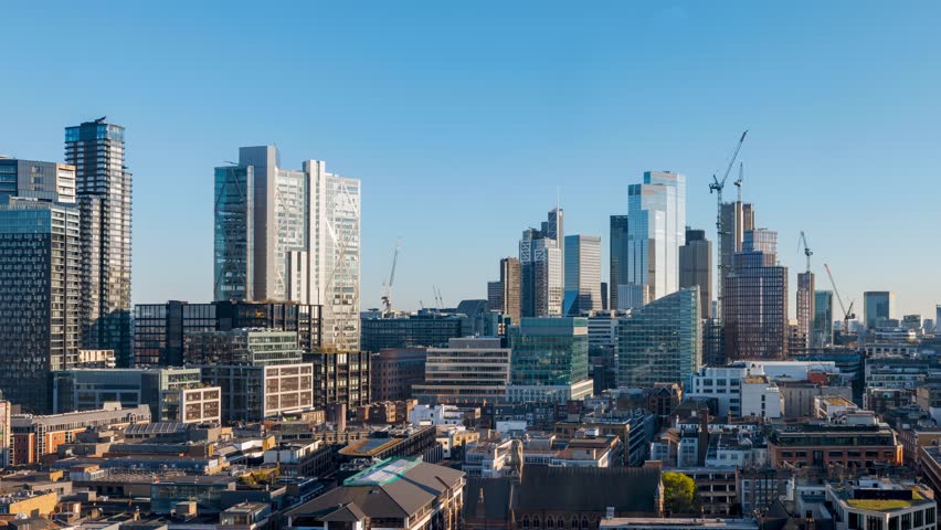 Panoramic day to night sunset time lapse view of the skyline at the City of London, England, from a unique viewpoint in the north